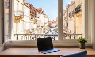 Furnished Split apartment workspace overlooking a bright Croatian street